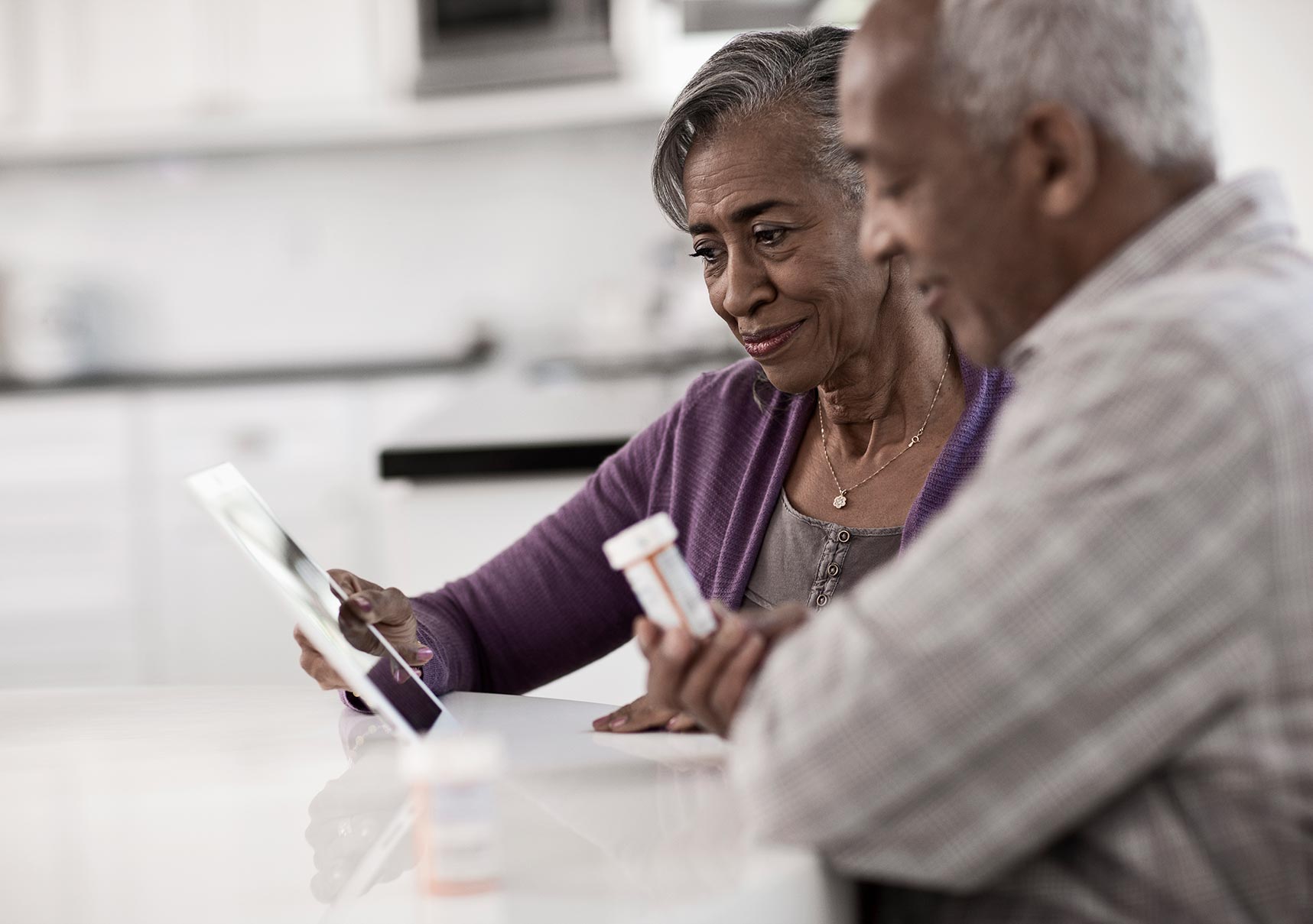 Happy couple reviewing Medicare options