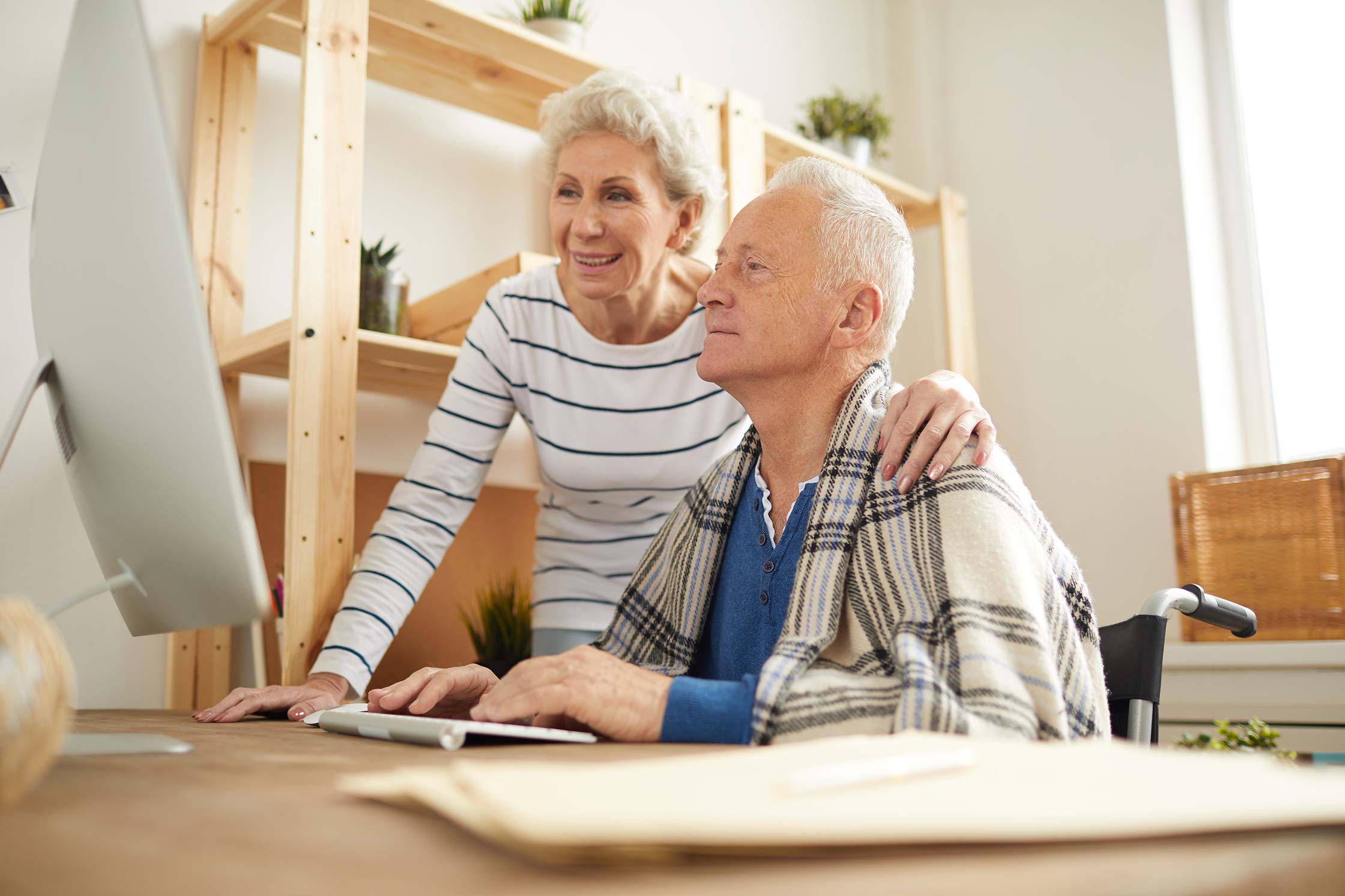 Senior couple smiling after Medicare consultation