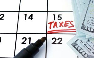 tax deadline and money on a calendar
