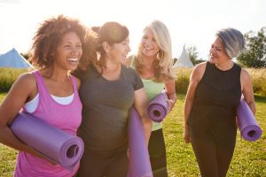 older women in menopause doing yoga