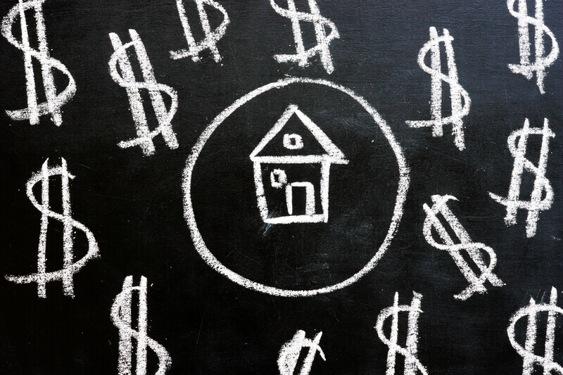 Loan and property investment concept. Chalk drawn house and dollar signs
