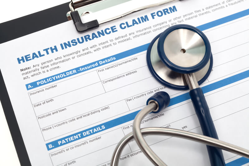 Health insurance claim. Medical and health reimbursement with stethoscope on clipboard