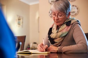 senior woman journaling