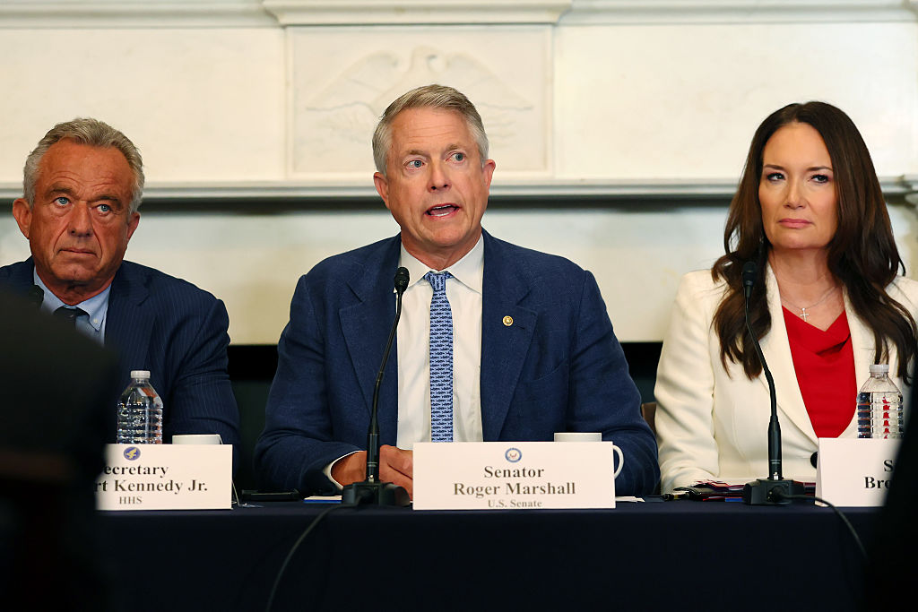 Health and Human Services (HHS) Secretary Robert F. Kennedy Jr., (L) U.S. Sen. Roger Marshall (R-KS), (C) and U.S. Secretary of Agriculture Brooke L. Rollins (R) attend a roundtable discussion on soil health in the Mike Mansfield Room at the U.S. Capitol on July 15, 2025 in Washington, DC.