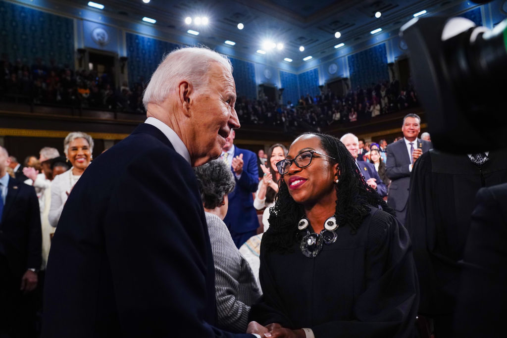 President Joe Biden greets Supreme Court Associate Justice Ketanji Brown Jackson as he enters the House chamber to deliver the annual State of the Union address before a joint session of Congress at the Capital building on March 7, 2024 in Washington, DC.
