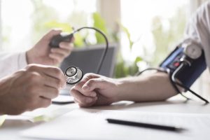 adult getting high blood pressure check