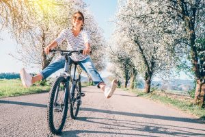 woman biking to feel better