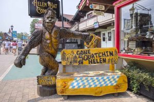 A large wooden statue of a sasquatch in Helen, GA.