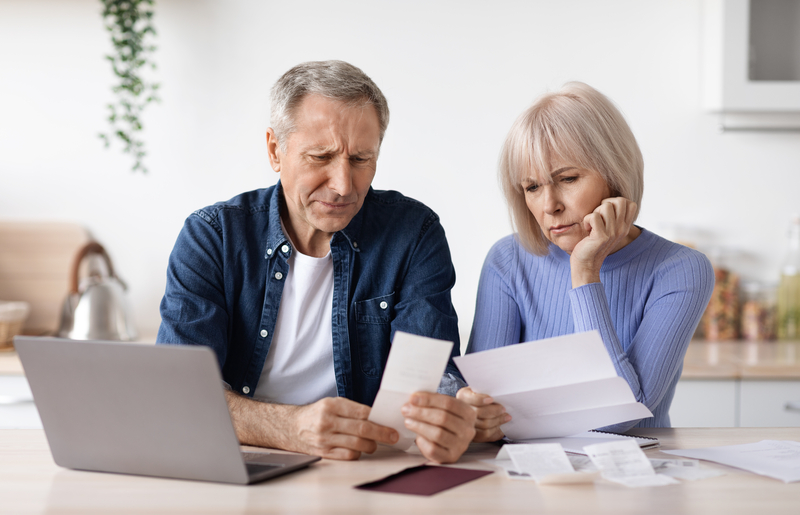 old couple looking at social security FRA and benefits