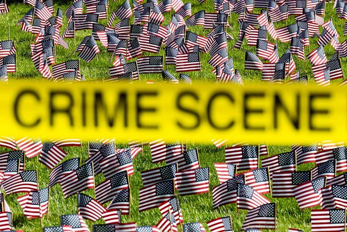 OREM, UTAH - SEPTEMBER 11: Crime scene tape flies in front of a 9/11 memorial following the fatal shooting of political activist Charlie Kirk during an event at Utah Valley University on September 11, 2025 in Orem, Utah. Authorities have released a "person of interest" as they search for the suspect who shot and killed Kirk, founder of Turning Point USA, while he was speaking at an event for his "American Comeback Tour". (Photo by Michael Ciaglo/Getty Images)