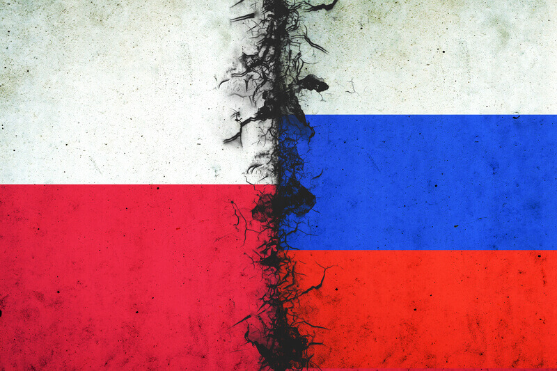 Cracked flags of Russia and Poland.