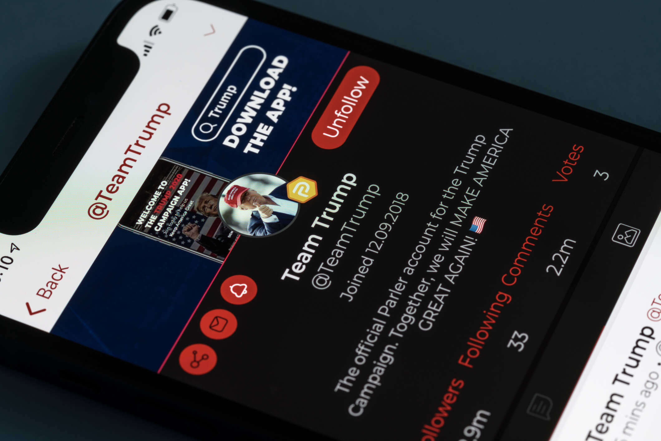 Modern smartphone with Parler social media App showing President Trumps account. Morgantown, WV - 9 January 2021: Modern phone with Parler social media app displaying Team Trump account in dispute with Twitter