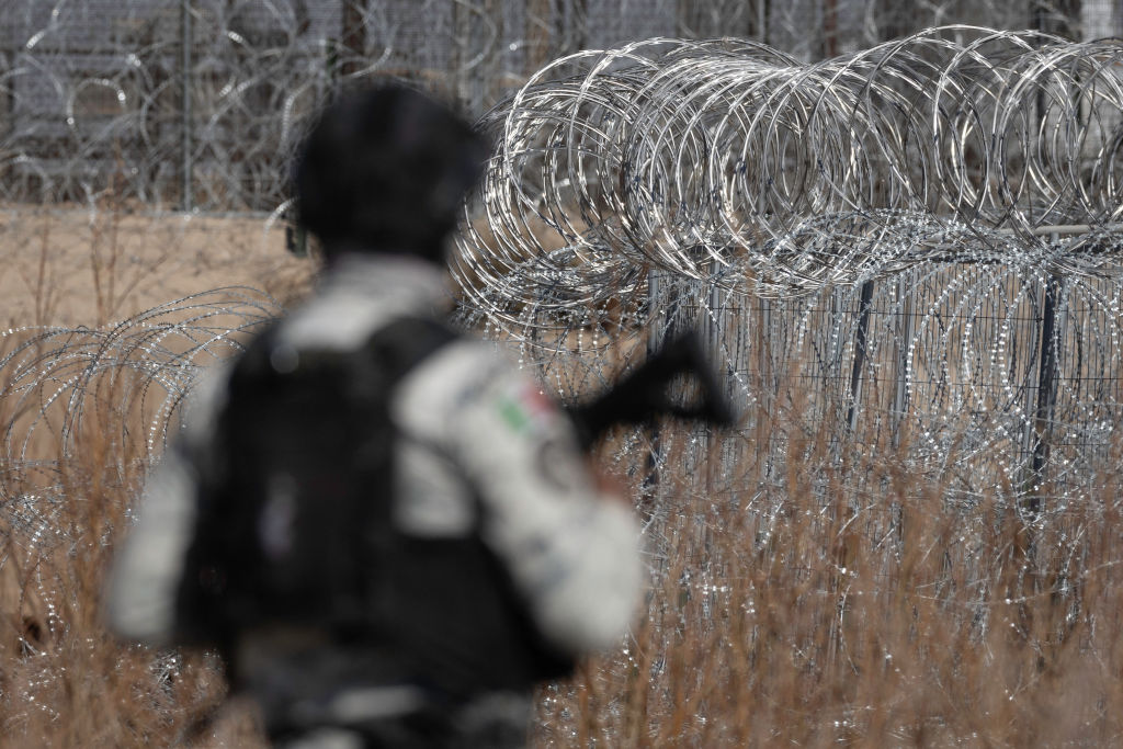 CIUDAD JUAREZ, MEXICO - FEBRUARY 06: A Mexican National Guard soldiers searches the bank of the Rio Grande for ladders used by smugglers and immigrants to cross the U.S.-Mexico border fence on February 06, 2025 near Ciudad Juarez, Mexico. Advance units of troops deployed to the border under orders of Mexican President Claudia Sheinbaum after U.S. President Donald Trump threatened tariffs on Mexican goods. (Photo by John Moore/Getty Images)