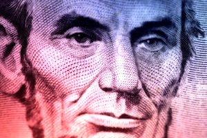 Macro Photo of Abraham Lincoln On The Five Dollar Bill With Color and Blur Effect.