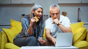 Senior couple prepares to work with AMAC Medicare Advisor