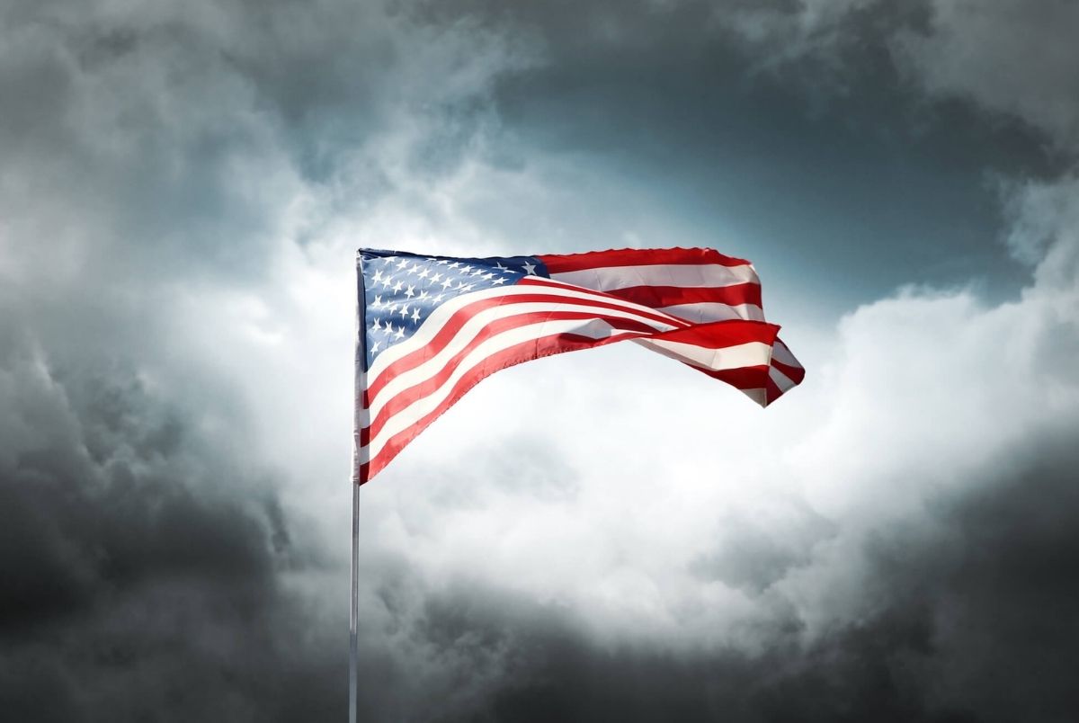 American flag on a dark cloudy dramatic sky
