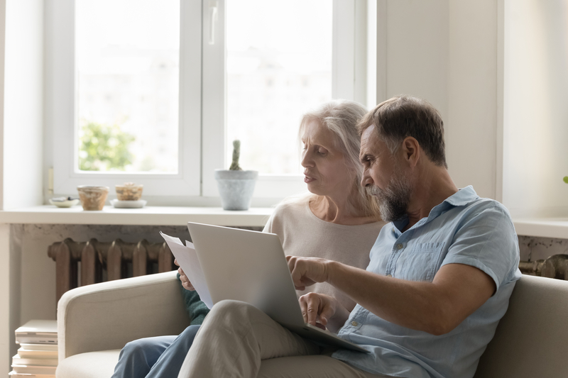old couple reviewing papers together for their Medicare plan