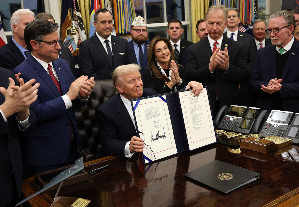 U.S. President Donald Trump signs funding legislation to reopen the federal government as he is joined by House Minority Leader Steve Scalise (R-LA), House Speaker Mike Johnson (R-LA), Republican lawmakers and business leaders, during a ceremony in the Oval Office of the White House on November 12, 2025, in Washington, DC.