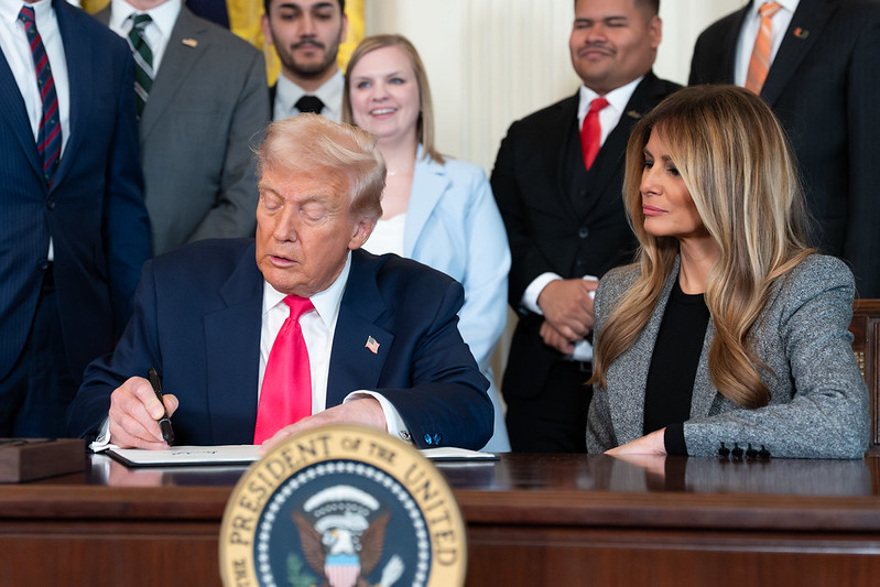 President Donald Trump signs a “Fostering the Future” executive order on foster care, Thursday, November 13, 2025, in the East Room of the White House.