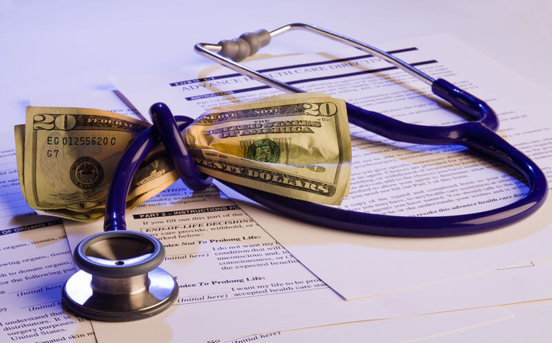stethoscope tied around money