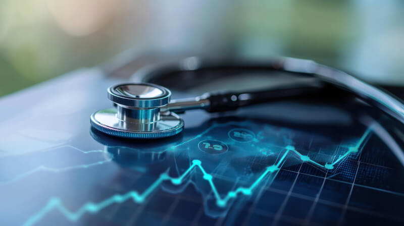 A Stethoscope on digital graph showing rising healthcare costs and trends