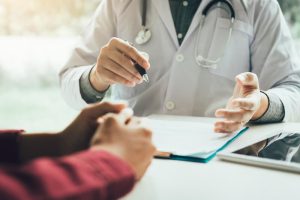 doctor with patient discussing weight