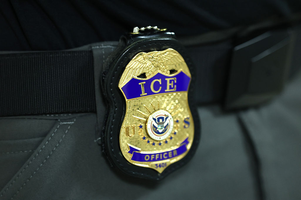 NEW YORK, NEW YORK - JUNE 09: The badge of an Immigration and Customs Enforcement (ICE) agent is seen as they patrol the halls of immigration court at the Jacob K. Javitz Federal Building on June 09, 2025 in New York City. Federal agents are arresting immigrants during mandatory check-ins, as ICE ramps up enforcement following immigration court hearings. The Trump administration has ordered officials to increase detentions to 3,000 migrants per day. (Photo by Michael M. Santiago/Getty Images)