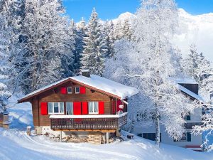 a scenic winter moment in a snowy, mountainous region, likely the Alps.