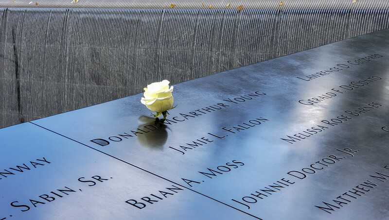 White Rose Recognizing the Birthday of those who perished in the 9/11 attacks. To keep the memory of those lost during the 9/11 attacks alive, a rose is placed next to the name of the deceased Birthday. The National September 11 Memorial & Museum also known as the 9/11 Memorial & Museum is a memorial and museum in New York City commemorating the September 11, 2001 attacks. The memorial is located at the World Trade Center site, the former location of the Twin Towers that were destroyed during the September 11 attacks. The names of 2,983 victims are inscribed on 152 bronze parapets on the memorial pools: 2,977 killed in the September 11 attacks and six killed in the 1993 World Trade Center bombing. The names are arranged based on relationships proximity at the time of the attacks, company or organization affiliations for those working at the World Trade Center or the Pentagon