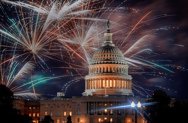 July 4th Independence day show cheerful fireworks display on the U. S. Capitol Building in Washington DC USA