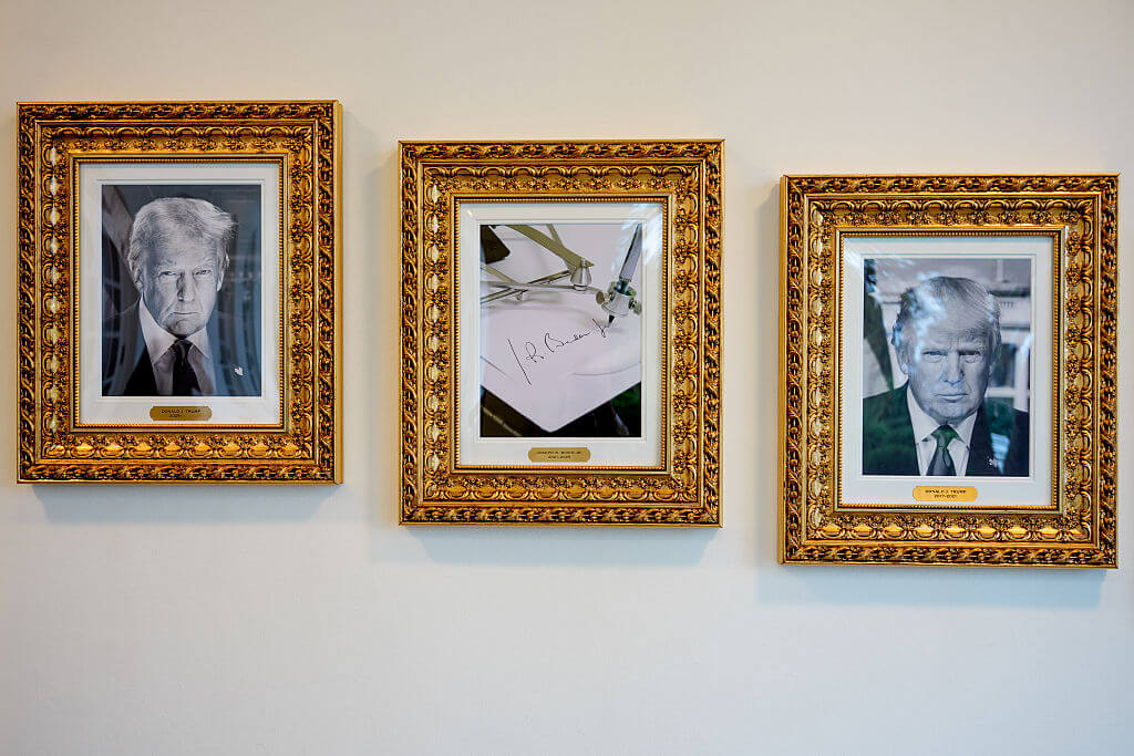 Framed portraits of U.S. President Donald Trump flank a image of former U.S. President Joe Biden's signature and an autopen along "The Presidential Walk of Fame" on the wall of the colonnade outside of the Oval Office as Trump meets with President of Turkey Recep Tayyip Erdogan at the White House on September 25, 2025 in Washington, DC.