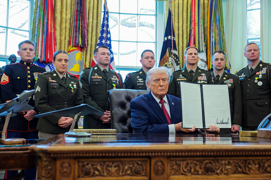 WASHINGTON, DC - DECEMBER 15: U.S. President Donald Trump poses with a recently signed executive order classifying fentanyl as a "weapon of mass destruction," during a ceremony for the presentation of the Mexican Border Defense Medal in the Oval Office of the White House on December 15, 2025 in Washington, DC. During the ceremony, Trump recognized the first 13 service members to receive the recently established Mexican Border Defense Medal (MBDM), which recognizes service members supporting Customs and Border Protection on the U.S.-Mexico border. (Photo by Anna Moneymaker/Getty Images)