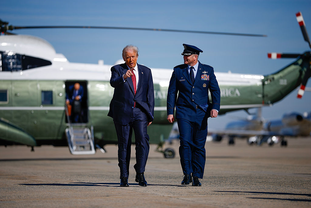 JOINT BASE ANDREWS, MARYLAND - NOVEMBER 05: U.S. President Donald Trump and U.S. Air Force Col. Christopher M. Robinson walks towards Air Force One on November 05, 2025 at Joint Base Andrews, Maryland. President Trump is traveling to Miami to deliver remarks at the America Business Forum. (Photo by Kevin Dietsch/Getty Images)