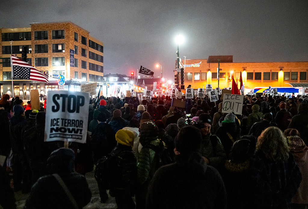 MINNEAPOLIS, MINNESOTA - JANUARY 08: (EDITOR'S NOTE: Image contains profanity.) People gather for a protest after the killing of Renee Nicole Good on January 08, 2026 in Minneapolis, Minnesota. According to federal officials, an ICE agent shot and killed Good during a confrontation yesterday in south Minneapolis. (Photo by Stephen Maturen/Getty Images)
