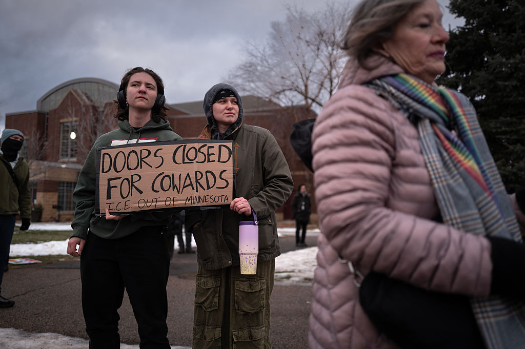 MINNEAPOLIS, MINNESOTA - JANUARY 13: Demonstrators protest outside of the Whipple federal building on January 13, 2026 in Minneapolis, Minnesota. Protest have sparked up around the city after a federal agent fatally shot a woman in her car during an incident in south Minneapolis on January 7. (Photo by Scott Olson/Getty Images)