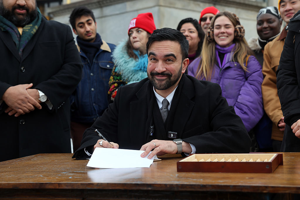 New York City Mayor Zohran Mamdani signs executive orders with campaign volunteers during an appearance at Grand Army Plaza in Brooklyn on January 02, 2026, in New York City.