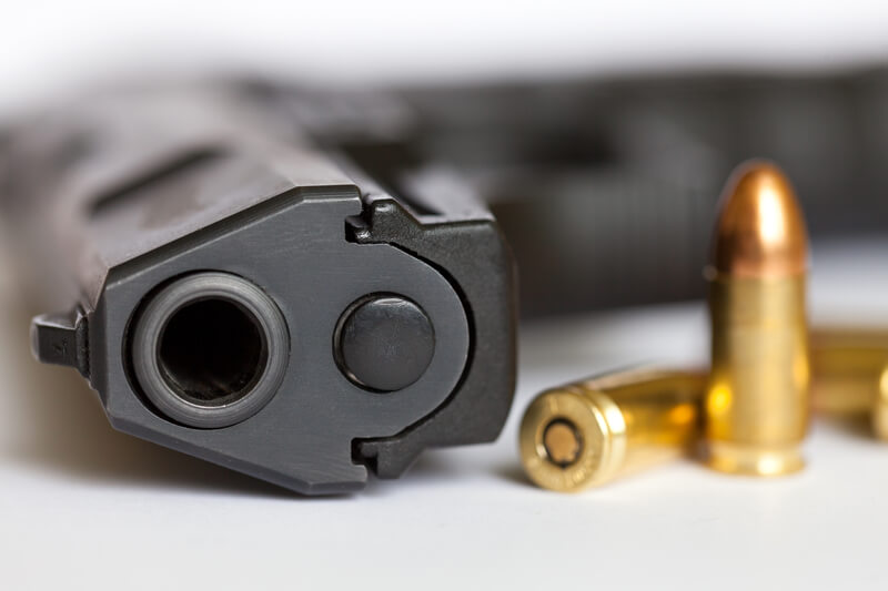 Police gun and bullets. 9 mm pistol and cartridges