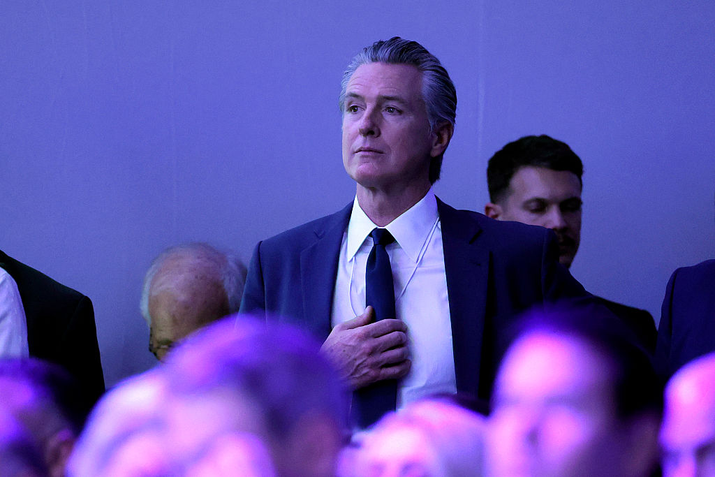 Gavin Newsom, the governor of California, watches as U.S. President Donald Trump gives a speech at the World Economic Forum (WEF) on January 21, 2026 in Davos, Switzerland.