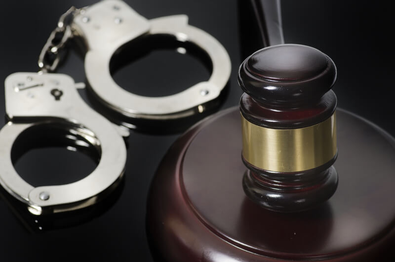 Legal concept gavel and handcuffs.
