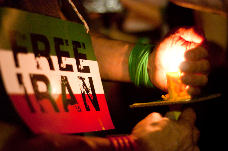 DC Vigil for Iran. WASHINGTON, DC - JULY 2, 2009: Activists participate in a candle light vigil at Washington, DC s Dupont Circle park to protest the outcome of Iranian elections in which Mahmoud Ahmadinejad claimed victory, and after which scores of Iranians have been killed in protests.