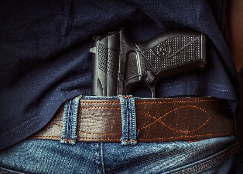 Gun in hand. Hiden gun in the hand