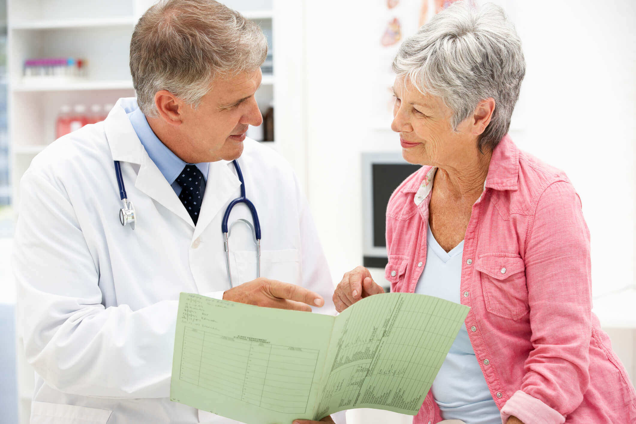 Doctor with female patient smiling