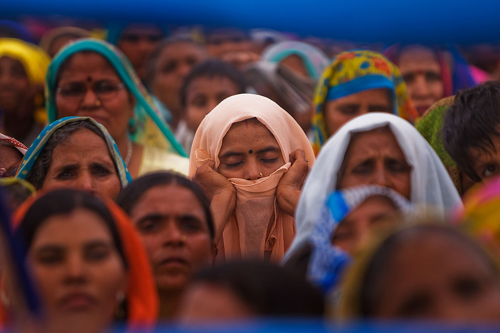 Supporters of Mayawati Kumari, of the Bahujan Samaj Party (BSP) and Chief Minister of Uttar Pradesh state listen to her speech during a political rally on April 6, 2009 in Palwal, India.