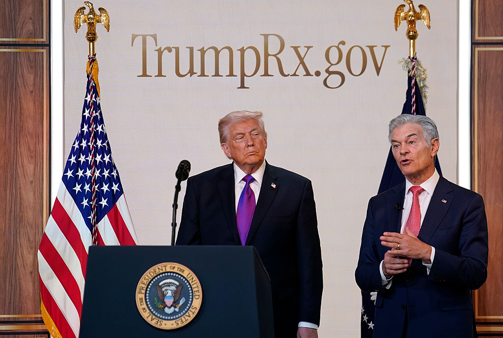 WASHINGTON, DC - FEBRUARY 5: Administrator for the Centers for Medicare & Medicaid Services Mehmet Oz speaks as U.S. President Donald Trump looks on during an event on drug pricing in the South Court Auditorium on the White House campus on February 5, 2026 in Washington, DC. The president announced the launch of TrumpRx, which the White House said would help lower prescription drug prices. (Photo by Nathan Howard/Getty Images)