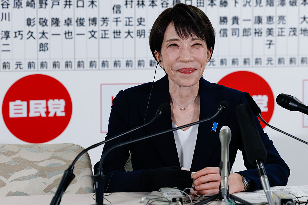 TOKYO, JAPAN - FEBRUARY 8: Japan's Prime Minister Sanae Takaichi, leader of the ruling Liberal Democratic Party (LDP), reacts as she speaks to the media in front of a board displaying the names of LDP candidates at the LDP headquarters on general election day on February 08, 2026 in Tokyo, Japan. Voters across the country headed to polls today as Japan's Lower House election was held. (Photo by Kim Kyung-Hoon - Pool/Getty Images)
