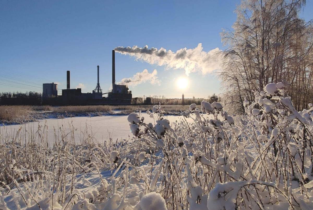 Espoo, Finland, January 01, 2024 - Gas and coal Suomenojan power plant in winter morning, Finland. With copy space
