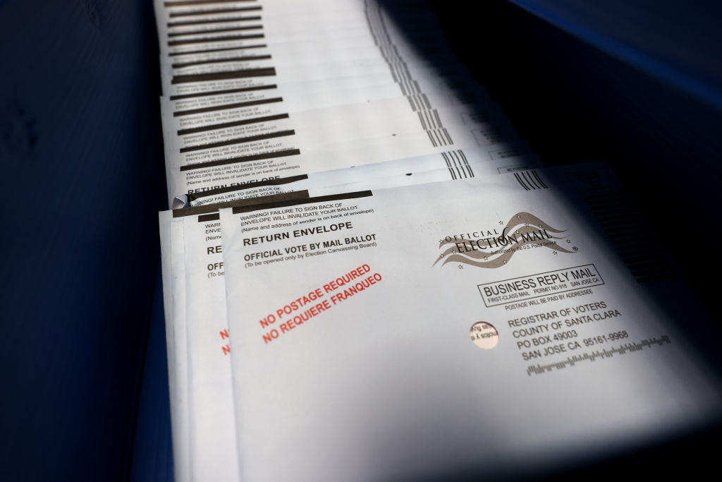 SAN JOSE, CALIFORNIA - OCTOBER 13: Mail-in ballots sit in trays before being sorted at the Santa Clara County registrar of voters office on October 13, 2020 in San Jose, California. The Santa Clara County registrar of voters is preparing to take in and process thousands of ballots as early voting is underway in the state of California. (Photo by Justin Sullivan/Getty Images)