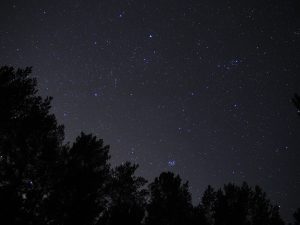 Night sky stars Auriga and Taurus constellation pleiades open star cluster.