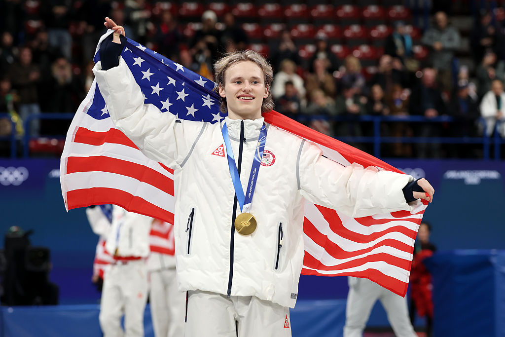 Gold medalist Ilia Malinin of Team United States celebrates after the medal ceremony for the Team Event on day two of the Milano Cortina 2026 Winter Olympic games at Milano Ice Skating Arena on February 08, 2026 in Milan, Italy.