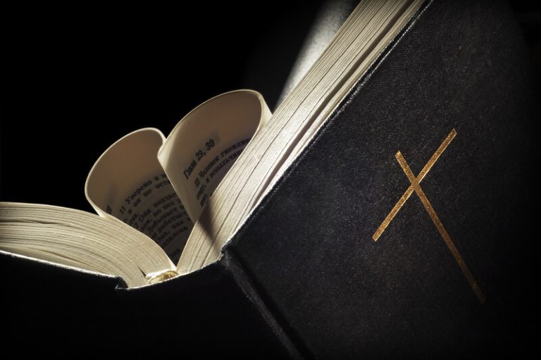 Pages of a bible curved into a heart shape
